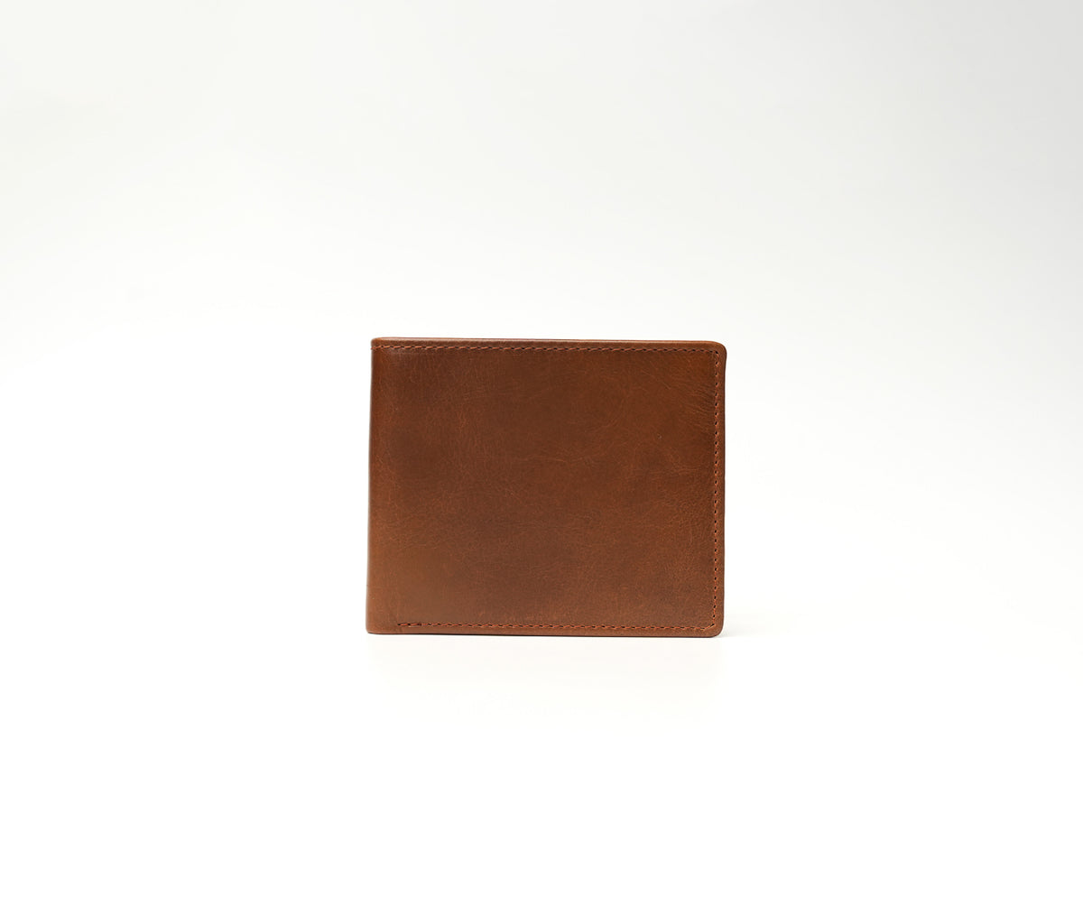 The Ambassador vintage brown full-grain leather wallet with microfiber lining, 3 card slots, 1 transparent window, and 1 cash compartment (10.5 × 8.5 cm).