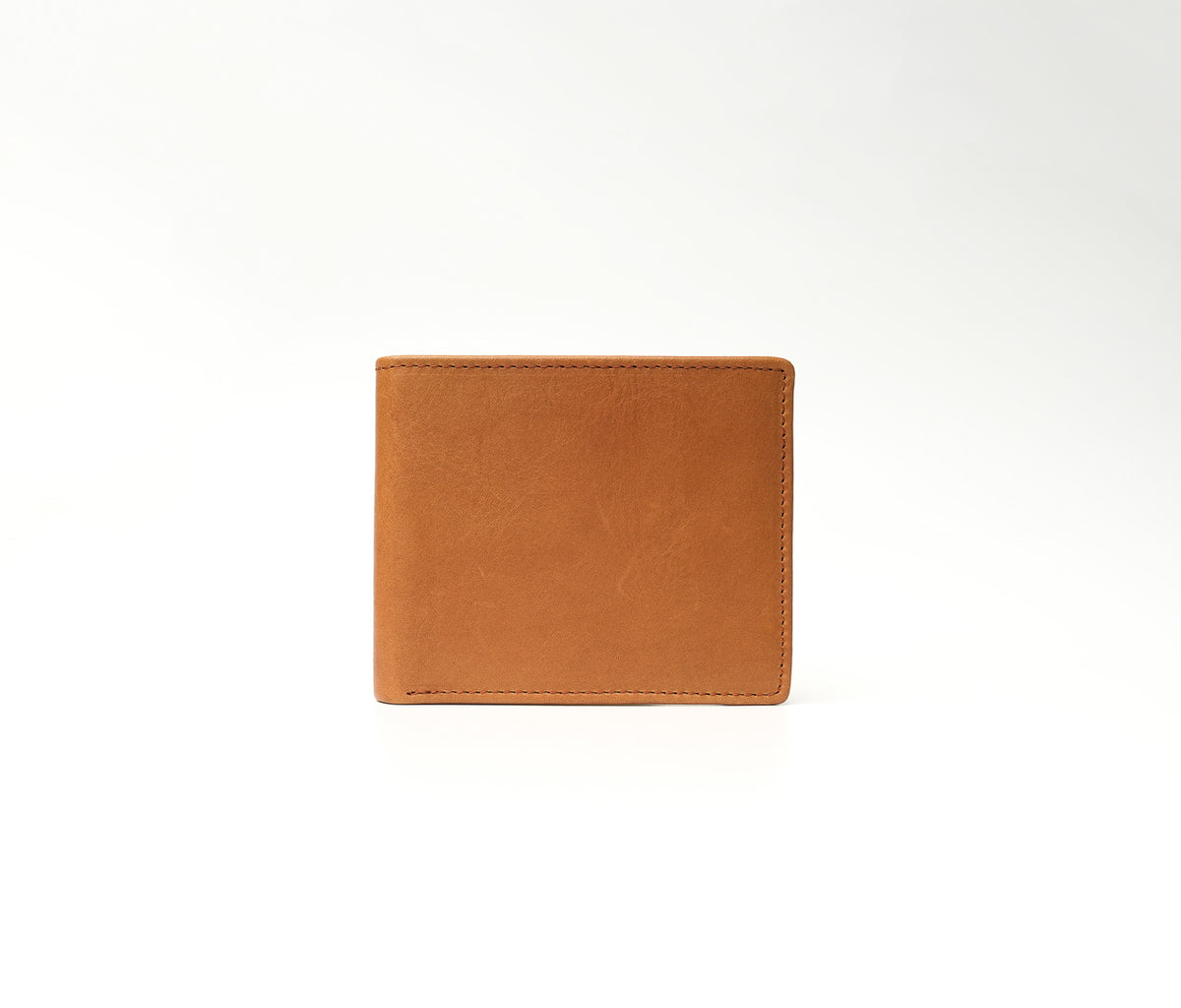 The Ambassador saddle brown full-grain leather wallet with microfiber lining, 3 card slots, 1 transparent ID window, and 1 cash compartment (10.5 × 8.5 cm)