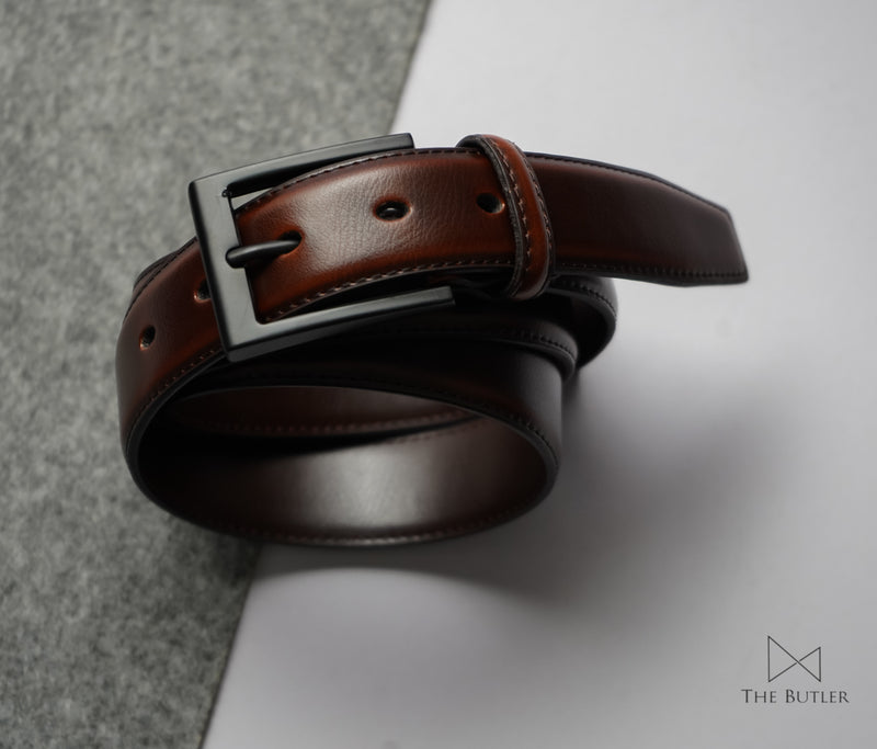 https://www.thebutlersrilanka.com/cdn/shop/files/Mercer-cinnamon-brown-black-buckle-slim-formal-office-business-synthetic-leather-belts-belt-men-mens-the-butler-sri-lanka.jpg?v=1690459567&width=800